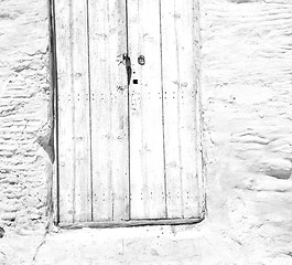 Image showing blue door in antique village santorini greece europe and white w