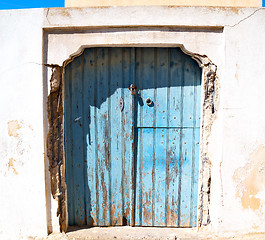 Image showing blue door in antique village santorini greece europe and    whit