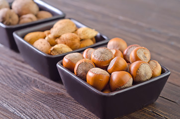 Image showing nuts in the black bowls