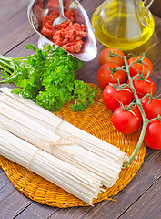 Image showing raw pasta and  tomato and sauce