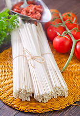 Image showing raw pasta and  tomato and sauce