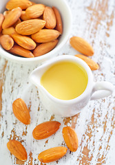 Image showing almond essential oil and almond in bowl