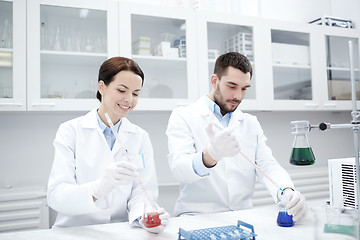 Image showing young scientists making test or research in lab