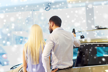 Image showing couple choosing car in auto show or salon