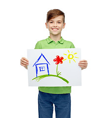 Image showing happy boy holding drawing or picture of home