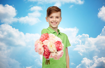 Image showing happy boy holding flower bunch