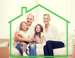 Image showing smiling parents and two little girls at new home