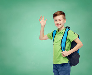 Image showing happy student boy with school bag waving hand