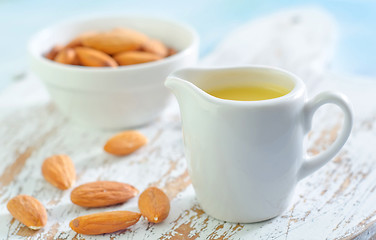 Image showing almond essential oil and almond in bowl