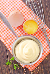 Image showing mayonnaise in metal spoon on wooden board