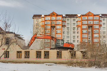 Image showing A digger demolishing houses for reconstruction