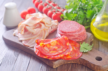 Image showing sausages,ham and salami on board