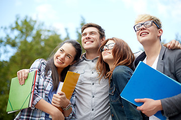 Image showing group of happy students with folders outdoors