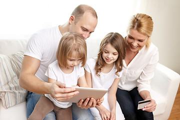 Image showing happy family with tablet pc and credit card