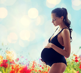 Image showing happy pregnant woman in black underwear