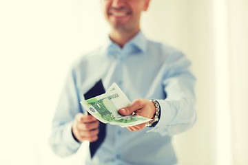 Image showing close up of businessman hands holding money