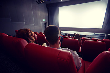 Image showing happy couple watching movie in theater or cinema