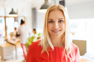 Image showing happy creative woman at office or bureau