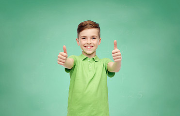 Image showing happy school boy in t-shirt showing thumbs up