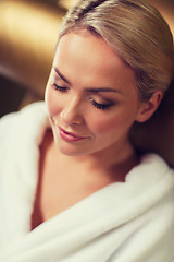 Image showing close up of woman sitting in bath robe at spa