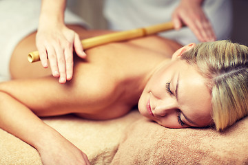 Image showing close up of woman lying and having massage in spa