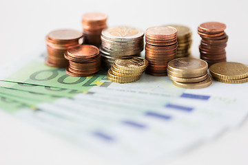 Image showing close up of euro paper money and coins on table