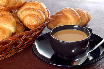Image showing cup of coffee with fresh croissants