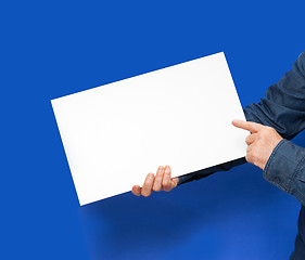 Image showing man holding a sign