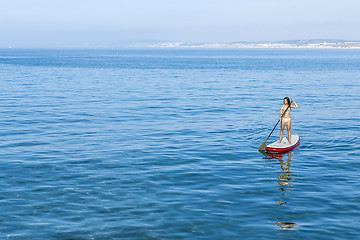 Image showing Woman practicing paddle