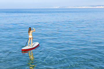 Image showing Woman practicing paddle