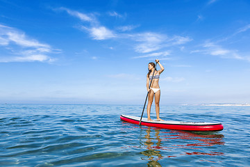 Image showing Woman practicing paddle