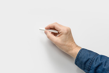Image showing hand with white crayon