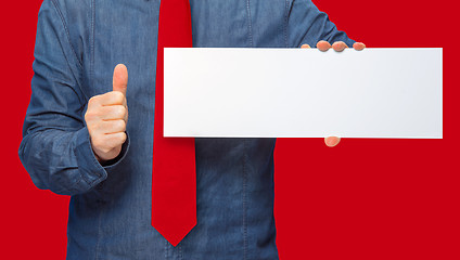 Image showing man holding a sign