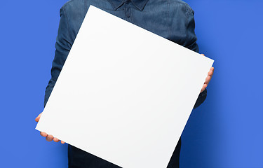 Image showing man holding a sign