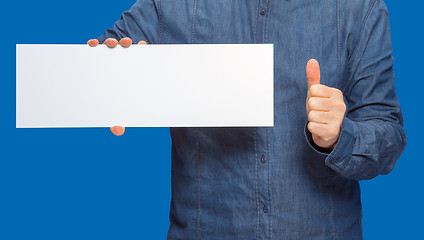 Image showing man holding a sign