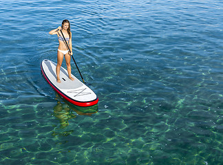 Image showing Woman practicing paddle