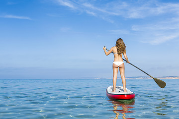 Image showing Woman practicing paddle