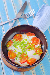 Image showing fried eggs with fresh tomato