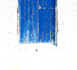 Image showing blue door in antique village santorini greece europe and    whit