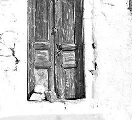 Image showing blue door in antique village santorini greece europe and    whit