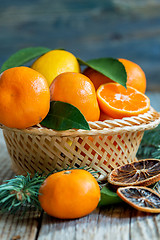 Image showing Tangerines and lemons in the basket.