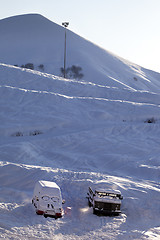 Image showing Snow-covered cars with smiley in windshield