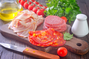 Image showing sausages,ham and salami on board