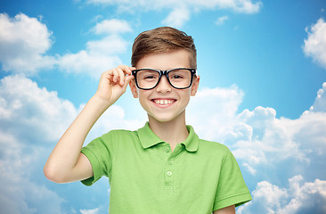 Image showing happy boy in green polo t-shirt and eyeglasses