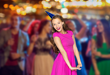 Image showing happy young woman or teen girl in party cap