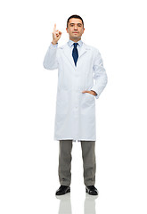 Image showing male doctor in white coat pointing finger up