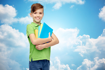 Image showing happy student boy with folders and notebooks