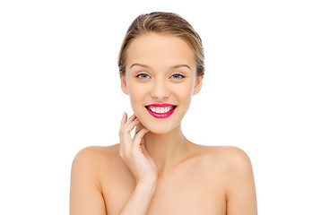 Image showing smiling young woman with pink lipstick on lips