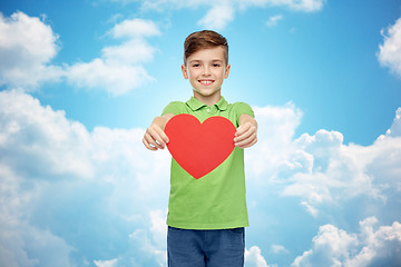 Image showing happy boy holding red heart shape