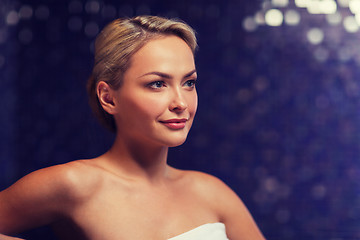 Image showing close up of young woman sitting in bath towel